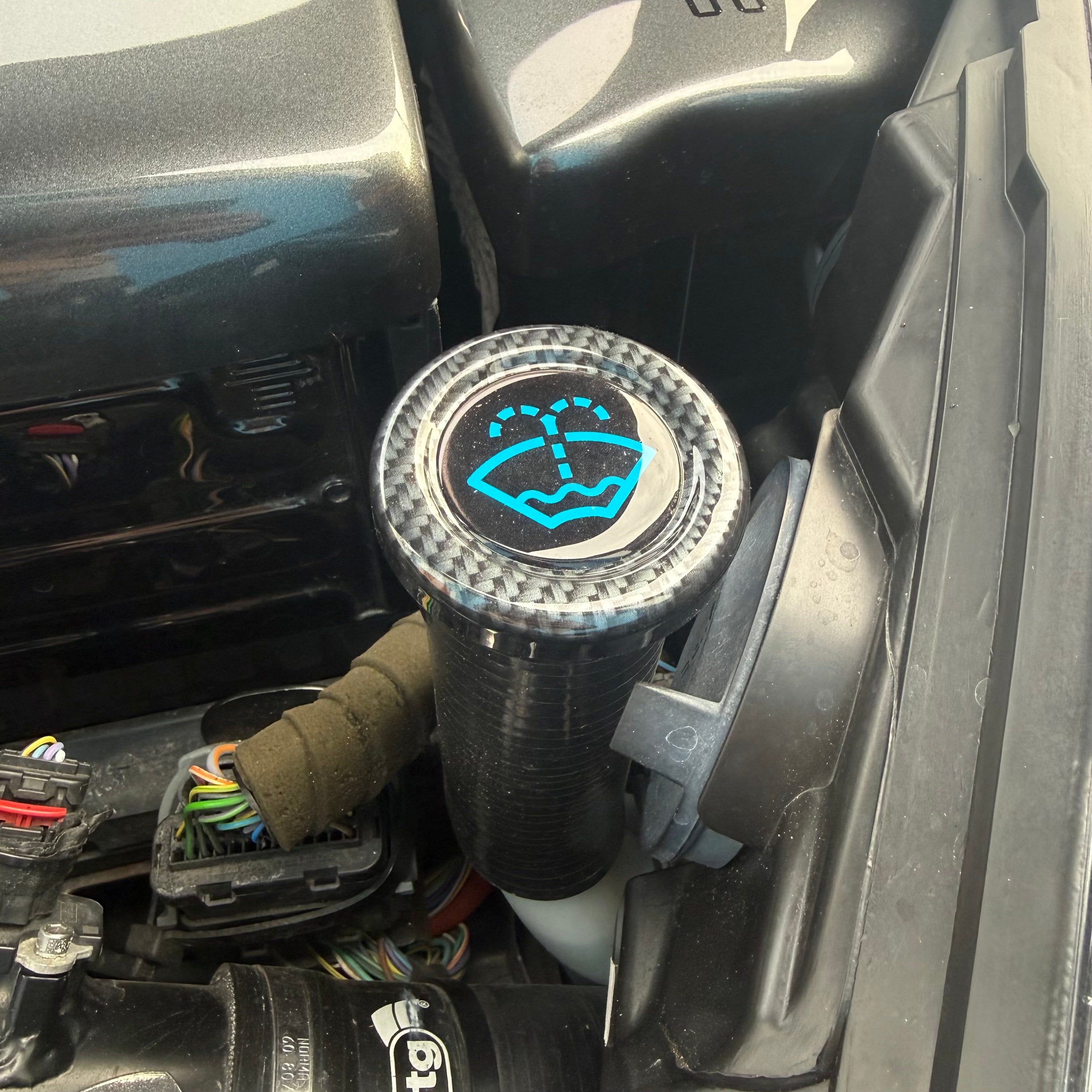 Proform Washer Bottle Bung - Multiple Ford Models - Deluxe Carbon Fibre Effect Plasitc With Light Blue Screenwash Logo Detailing